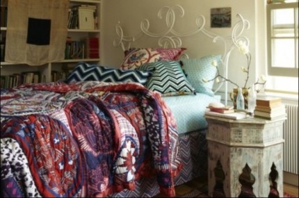 comfortable-boho-chic-bedroom-with-soft-blue-double-bed-and-unique-classic-night-table-also-beautiful-white-flowers-and-cool-white-book-shelves
