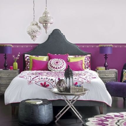 glamorous-boho-bedroom-with-spectacular-black-queen-bed-and-smooth-white-sheet-also-sweet-purple-cushions-and-soft-black-puff-with-unique-silver-chandelier